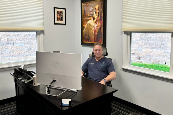 Dr. Allen seated in his office.


