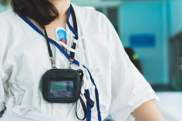 A girl monitoring her heart using a Holter Monitor 